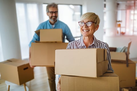 Happy senior couple downsizing into a new home