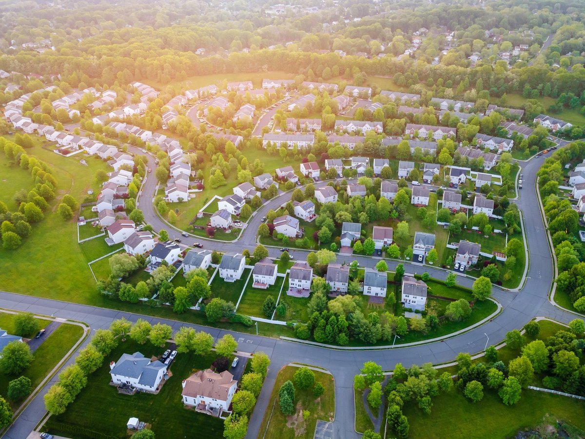 Aerial panorama view of a small town city home roofs at suburban residential quarters