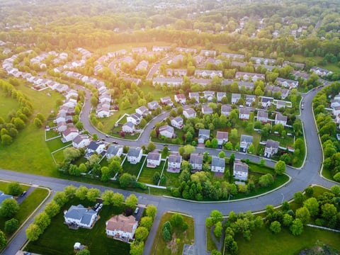 Aerial panorama view of a small town city home roofs at suburban residential quarters