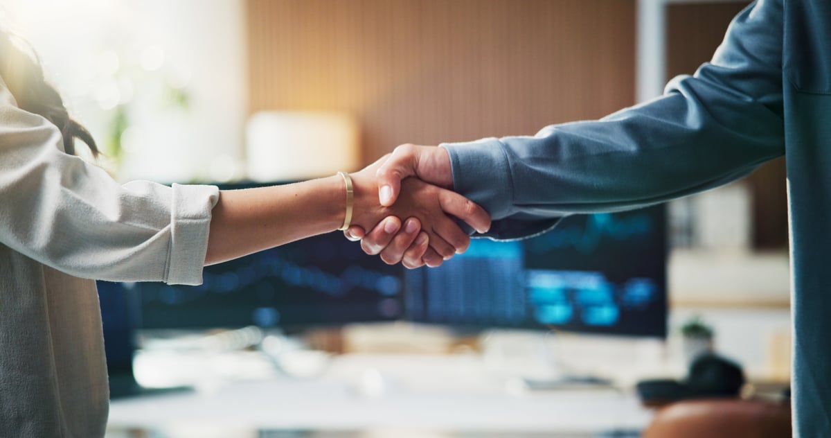 Handshake, contract and business people in office with coding project, agreement or partnership. Meeting, welcome and programmer shaking hands with client for web development deal in workplace.