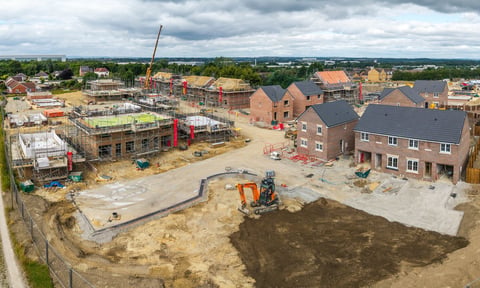 Aerial landscape view above a construction site building new and affordable eco friendly houses