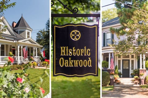 Historic Oakwood sign with colonial homes and American flags displaying the historic neighborhood district