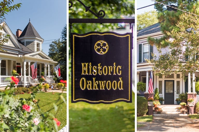 Historic Oakwood sign with colonial homes and American flags displaying the historic neighborhood district