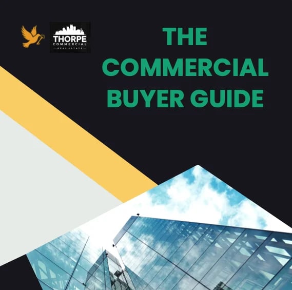 Thorpe Commercial branding and The Commercial Buyer Guide title with modern building architecture against geometric yellow and black design elements